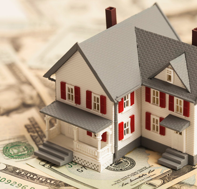 Single-family-home-model-placed-on-cash